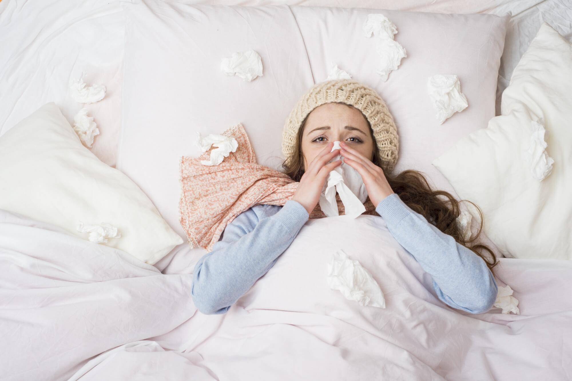Women sick in bed 
